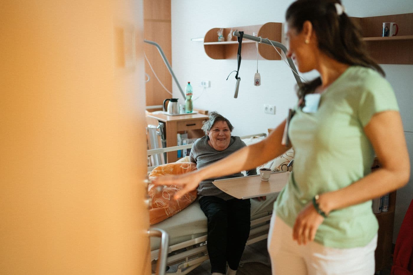 A care worker talking with a resident